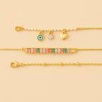 Bundle: Pulseira Dourada de Pérolas | Pulseira Dourada de Pedras | Pulseira Dourada Cruz - Minha loja