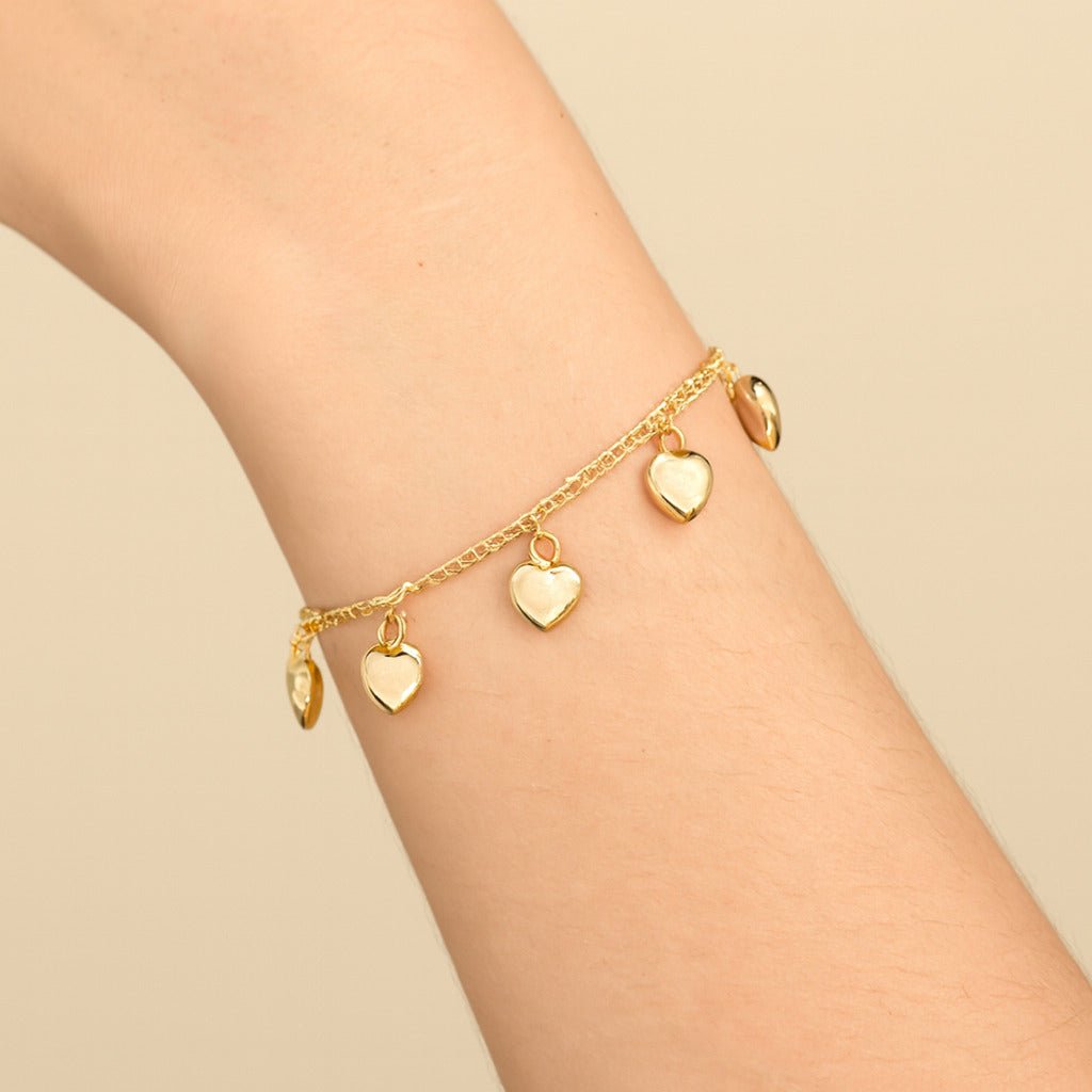 Pulseira Dourada com Pingentes de Coração Auryn - Minha loja