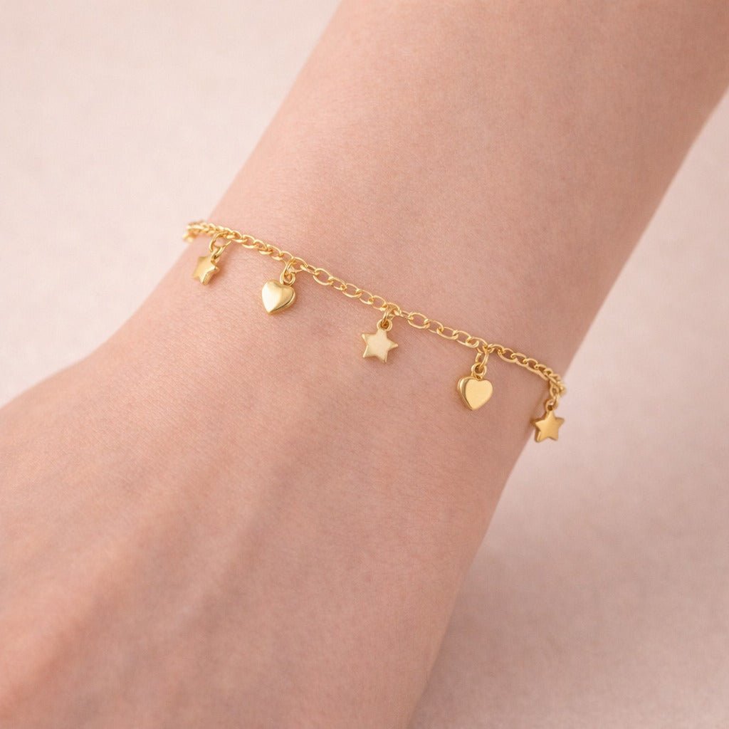 Pulseira Dourada com Pingentes de Coração e Esferas Auryn - Minha loja