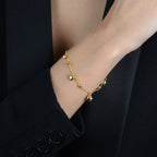 Pulseira Dourada com Pingentes de Coração e Esferas Auryn - Minha loja