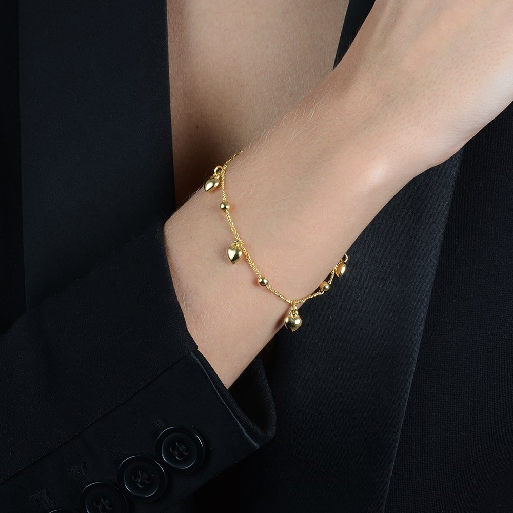 Pulseira Dourada com Pingentes de Coração e Esferas Auryn - Minha loja