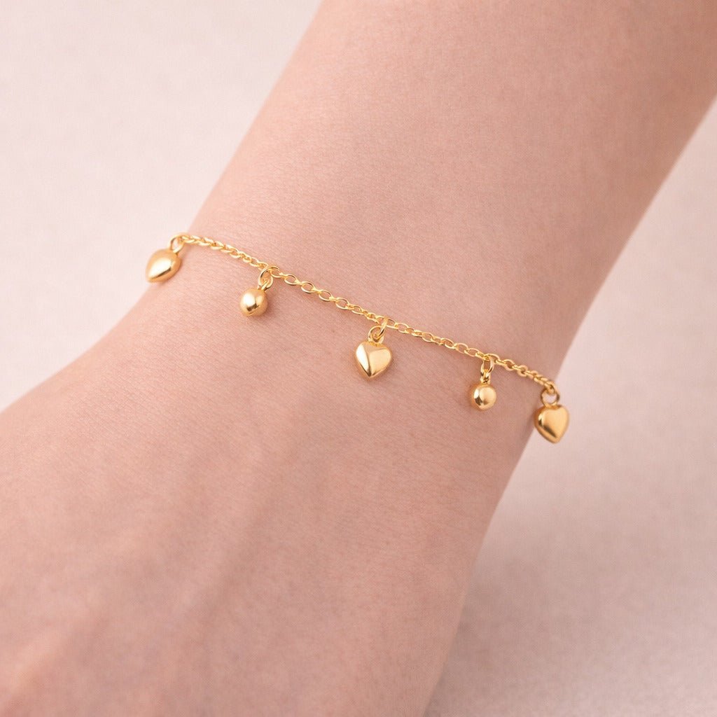 Pulseira Dourada com Pingentes de Coração e Estrela Auryn - Minha loja