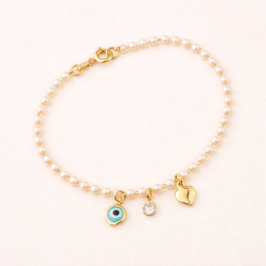 Pulseira Dourada de Pérolas com Olho Grego Coração e Ponto de Luz Auryn - Minha loja