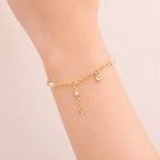 Pulseira Dourada de Pérolas com Ponto de Luz Auryn - Minha loja