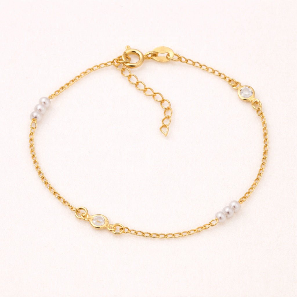 Pulseira Dourada de Pérolas com Ponto de Luz Auryn - Minha loja