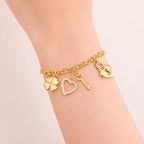 Pulseira Dourada Elo Português com Coração, Cadeado, Trevo e Chave Auryn - Minha loja