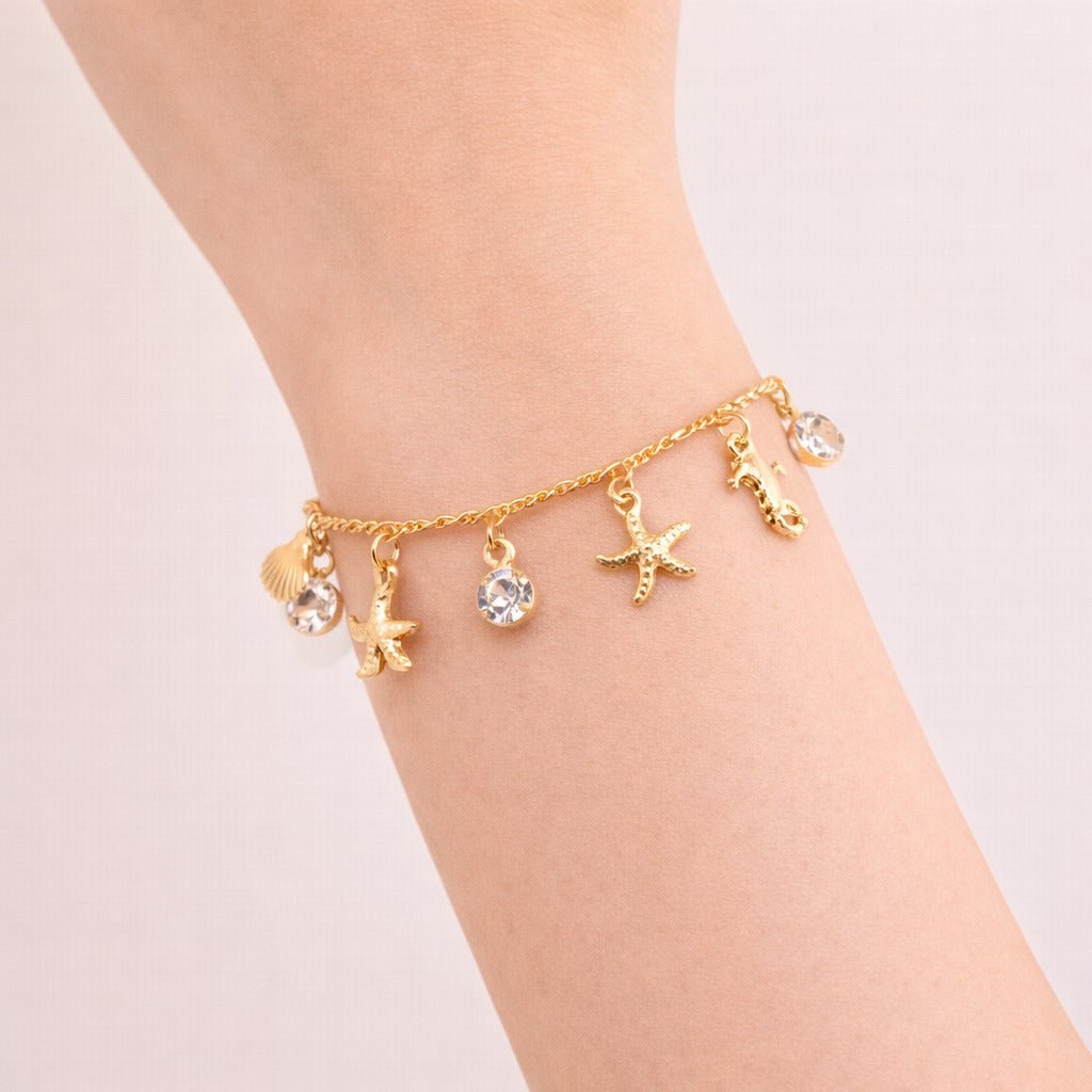 Pulseira Dourada Fundo do Mar e Ponto de Luz Auryn - Minha loja