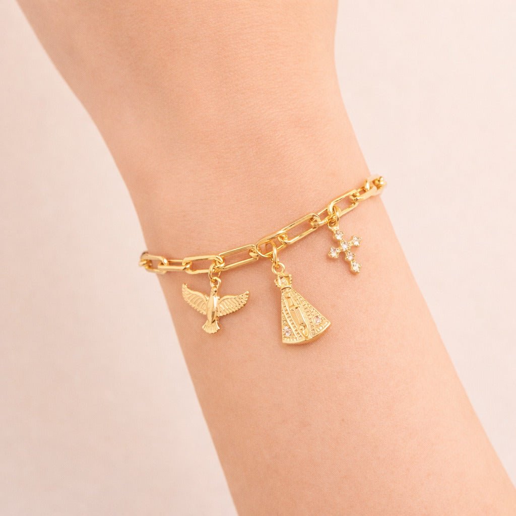 Pulseira Dourada Religiosa Nossa Senhora, Espírito Santo e Cruz Cravejada de Zircônia Auryn - Minha loja